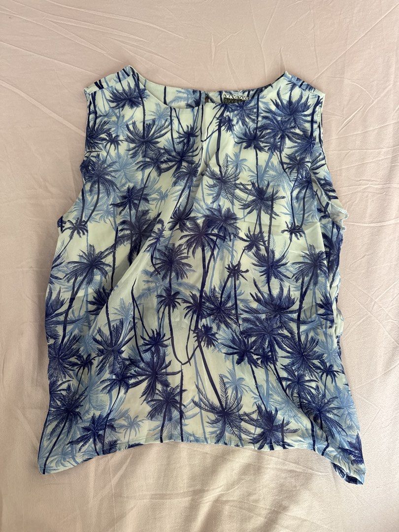 Oxygen Palm Tree Print Top - Size L (Category: Others Tops) located in Manila. Submitted by aimelamode (Listing ID 1432865419, Image 1). Description: - Size: L - Style: Sleeveless top - Print: Blue palm tree - Neckline: Round - Back: Keyhole with tie closure - Fabric: Lightweight, possibly sheer.