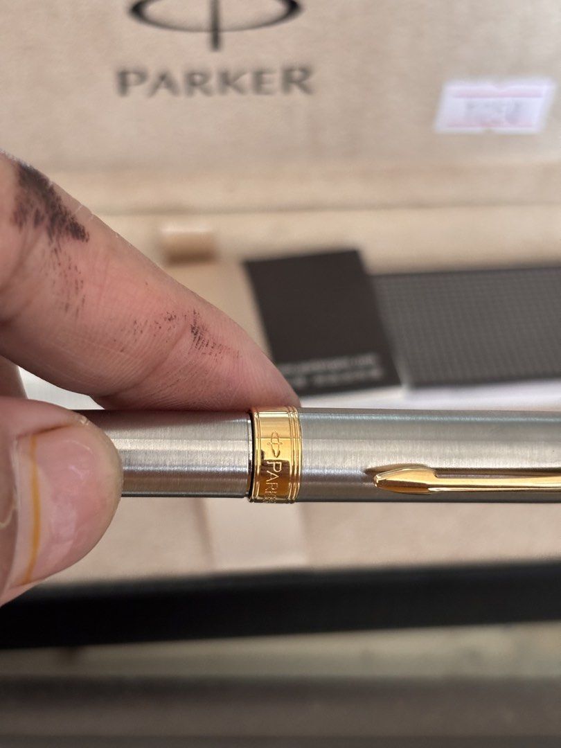 Parker Pen with Box (Category: Stationery & School Supplies) located in Victoria. Submitted by eliphalez (Listing ID 1432855774, Image 2). Description: - Parker pen with original box and paperwork - Silver body with gold accents - Perfect gift or collector's item Issue no ink.