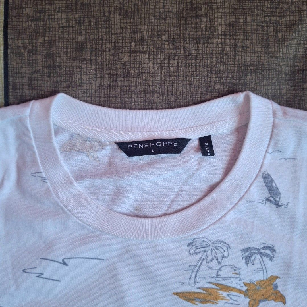 Penshoppe Printed T-shirt - Large (Category: Tshirts & Polo Shirts ) located in Manila. Submitted by thealmightyone (Listing ID 1432802501, Image 3). Description: - Penshoppe T-shirt - Size: Large - Design: All-over beach print - Neckline: Crew neck - Sleeves: Short sleeves - Material: Lightweight - Color: White with colorful print - Ideal for casual wear.