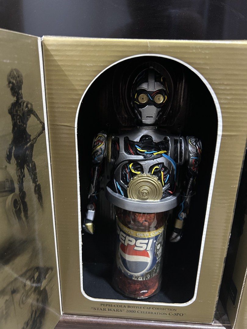 Pepsi Star Wars 2000 C-3PO Bottle Cap (Category: Vintage Collectibles) located in Victoria. Submitted by pisangpaulotoys (Listing ID 1432846232, Image 3). Description: - Pepsi Star Wars 2000 C-3PO bottle cap. - Features a C-3PO figure. - Gold-colored box with Star Wars and Pepsi branding. - From the Pepsi-Cola Bottle Cap Collection..