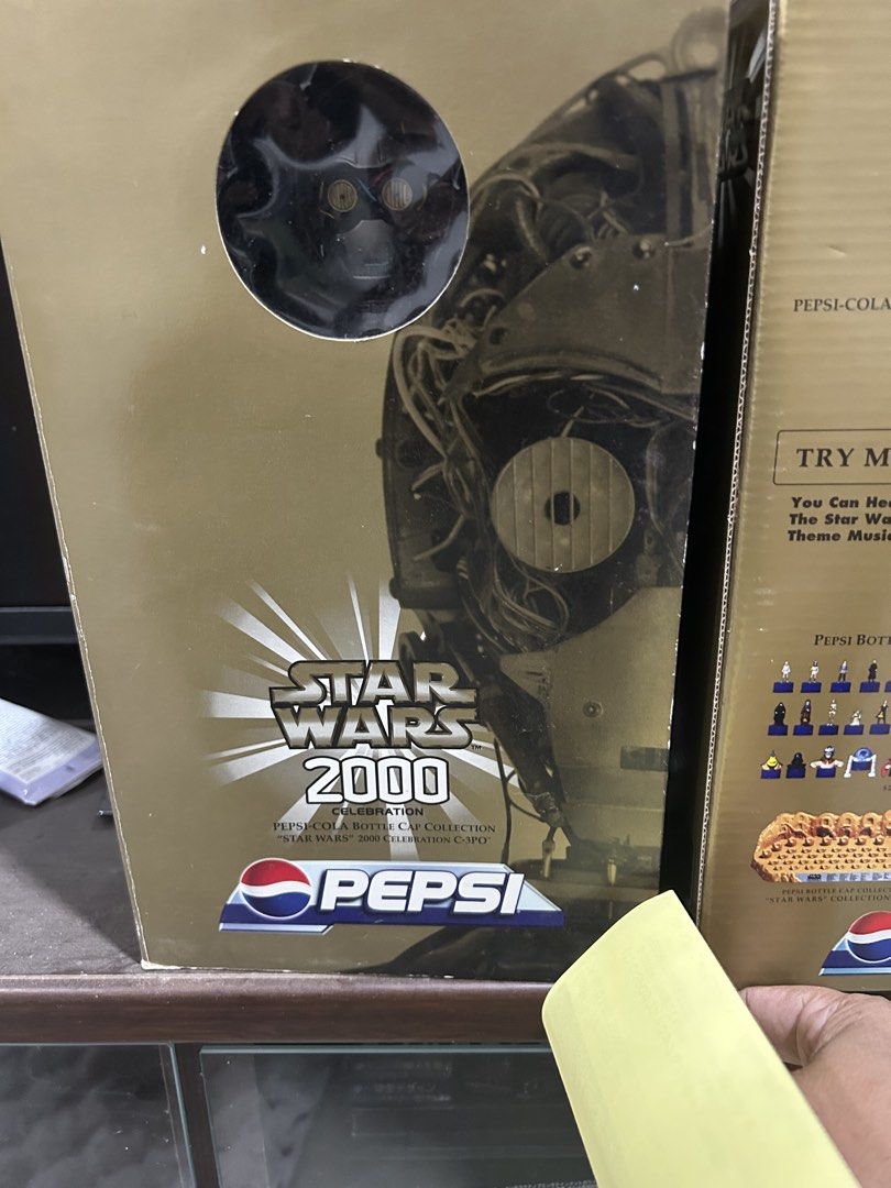 Pepsi Star Wars 2000 C-3PO Bottle Cap (Category: Vintage Collectibles) located in Victoria. Submitted by pisangpaulotoys (Listing ID 1432846232, Image 1). Description: - Pepsi Star Wars 2000 C-3PO bottle cap. - Features a C-3PO figure. - Gold-colored box with Star Wars and Pepsi branding. - From the Pepsi-Cola Bottle Cap Collection..
