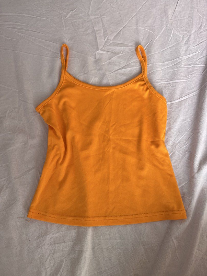 Plin Orange Spaghetti Strap Tank Top (Category: Sleeveless) located in Manila. Submitted by aimelamode (Listing ID 1432867636, Image 1). Description: Orange spaghetti strap tank top. Lightweight and versatile, perfect for layering. Classic design..