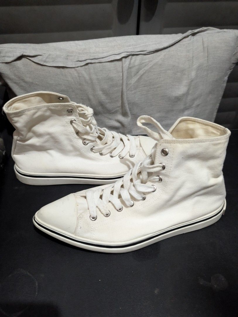 Prada High-Top Sneakers (Category: Sneakers) located in Imus. Submitted by kmoort (Listing ID 1432848390, Image 2). Description: - Prada high-top sneakers - Color: White - Design: Lace-up - Features Prada logo (tongue and sole) - Material: Canvas upper, rubber sole - Condition: Pre-owned issue refer to pic no 4.
