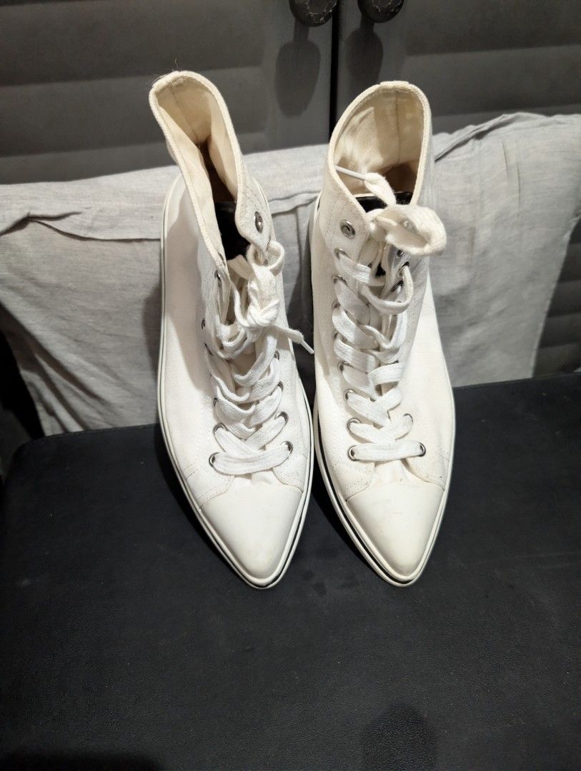 Prada High-Top Sneakers (Category: Sneakers) located in Imus. Submitted by kmoort (Listing ID 1432848390, Image 1). Description: - Prada high-top sneakers - Color: White - Design: Lace-up - Features Prada logo (tongue and sole) - Material: Canvas upper, rubber sole - Condition: Pre-owned issue refer to pic no 4.