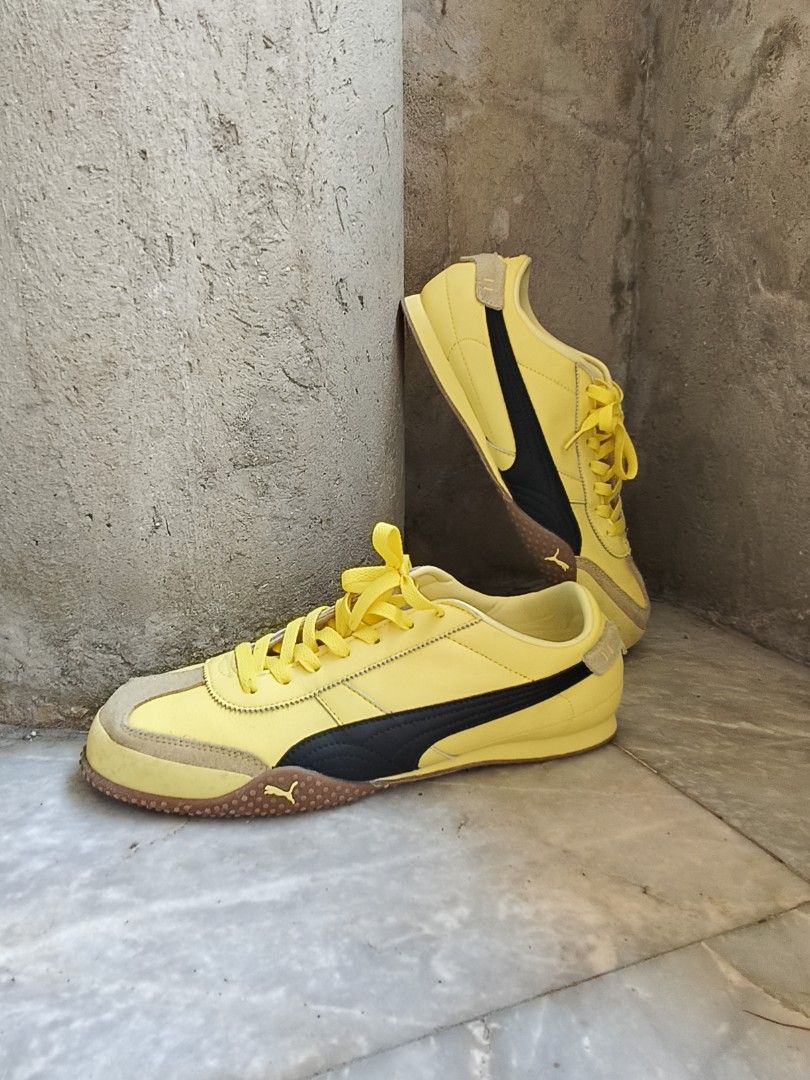 Puma Bella Ut Yellow Sneakers (Category: Sneakers) located in Tagbilaran City. Submitted by johnmcee (Listing ID 1432868076, Image 1). Description: - Puma sneakers in bright yellow color - Black accents - Suede toe cap - Puma logo on heel and sole - Brown soles with wear - Yellow laces - Sporty and stylish design.