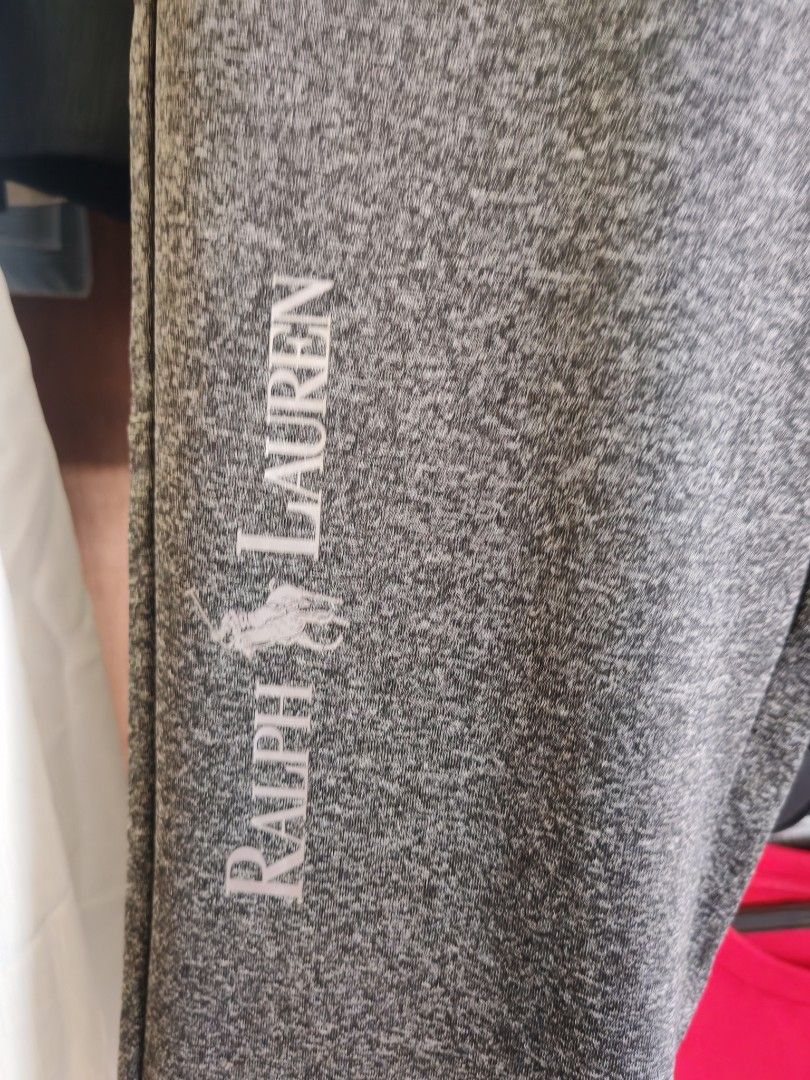 Ralph Lauren track pants /joggerpants (Category: Luxury Apparel) located in Quezon City. Submitted by rowem (Listing ID 1432834211, Image 2). Description: A heather grey and black colorblock track pants Ralph Lauren. The pants feature a dark grey marl main body, black diagonal cut-and-sew panels across the mid-thigh, and a black elasticated waistband with a drawstring. Product Details Design: These are casual, slim-to-regular fit joggers with a d