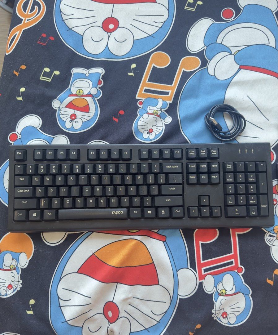Rapoo Keyboard and Mouse Combo (Category: Computer Keyboard) located in Taguig. Submitted by seek_and_ship (Listing ID 1432898903, Image 2). Description: - Rapoo keyboard and mouse combo - Standard keyboard layout with number pad - Wired optical mouse - Black cables - Ideal for everyday use.