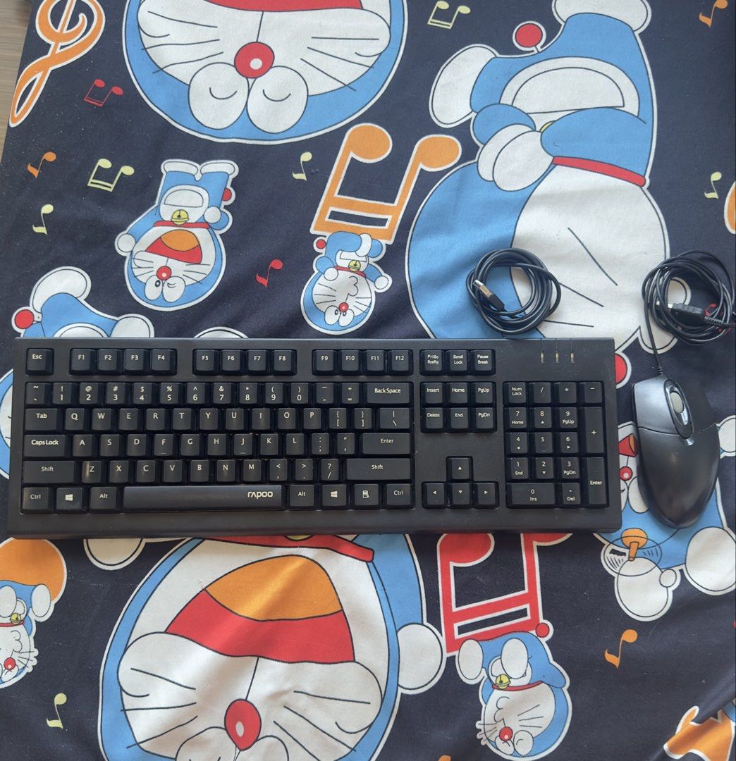 Rapoo Keyboard and Mouse Combo (Category: Computer Keyboard) located in Taguig. Submitted by seek_and_ship (Listing ID 1432898903, Image 1). Description: - Rapoo keyboard and mouse combo - Standard keyboard layout with number pad - Wired optical mouse - Black cables - Ideal for everyday use.