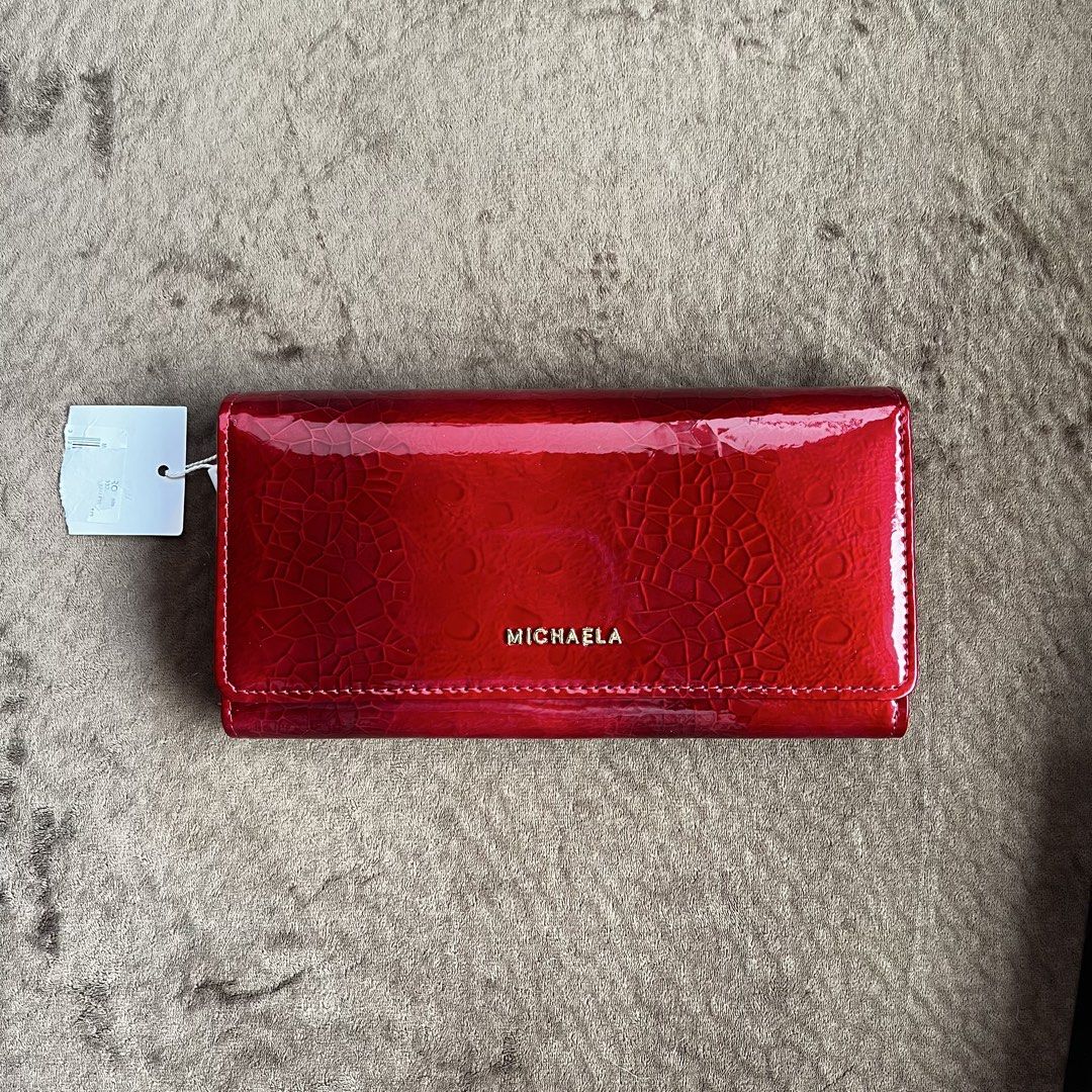 Red michaela trifold long wallet still new with box (Category: Wallets & Card holders) located in Makati City. Submitted by monu__ (Listing ID 1432907303, Image 1). Description: Michaela red shiny wallet 3d-looking design, rich red color Trifold wallet with lots of pockets/card holders Box and plastic still included Cut tag .