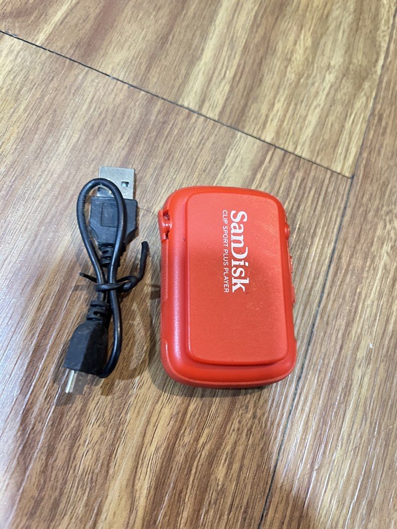 SanDisk Clip Sport Plus MP3 Player (Category: Portable Music Players) located in Quezon City. Submitted by manilathrifter (Listing ID 1432926637, Image 2). Description: - SanDisk Clip Sport Plus MP3 Player (Red) - Includes USB charging cable - Preloaded with music from hartists like Alex Goot, Arkana, and Ash 15 Gb of music - Fully functional and ready to use - Perfect for workouts and on-the-go listening -32 gb capacity storage -mp3 player and c
