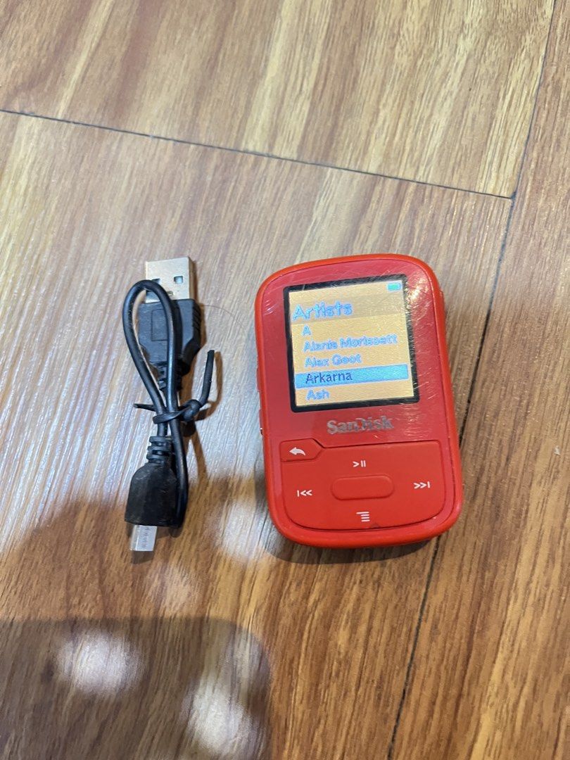 SanDisk Clip Sport Plus MP3 Player (Category: Portable Music Players) located in Quezon City. Submitted by manilathrifter (Listing ID 1432926637, Image 1). Description: - SanDisk Clip Sport Plus MP3 Player (Red) - Includes USB charging cable - Preloaded with music from hartists like Alex Goot, Arkana, and Ash 15 Gb of music - Fully functional and ready to use - Perfect for workouts and on-the-go listening -32 gb capacity storage -mp3 player and c