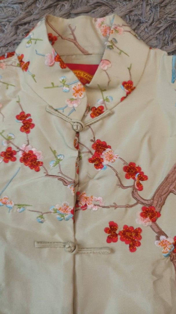 Shanghai Tang Floral Embroidered Jacket (Category: Coats, Jackets and Outerwear) located in Mandaluyong City. Submitted by bestill4610 (Listing ID 1432948229, Image 3). Description: - Shanghai Tang jacket - Floral embroidery - Mandarin collar - Frog closures - Light beige color - Red, pink, and blue floral details - 100% silk - Two front pockets - Long sleeves - W 21" x L 21".