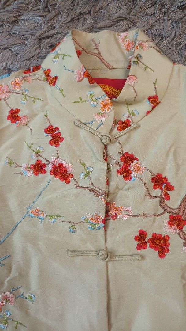 Shanghai Tang Floral Embroidered Jacket (Category: Coats, Jackets and Outerwear) located in Mandaluyong City. Submitted by bestill4610 (Listing ID 1432948229, Image 2). Description: - Shanghai Tang jacket - Floral embroidery - Mandarin collar - Frog closures - Light beige color - Red, pink, and blue floral details - 100% silk - Two front pockets - Long sleeves - W 21" x L 21".