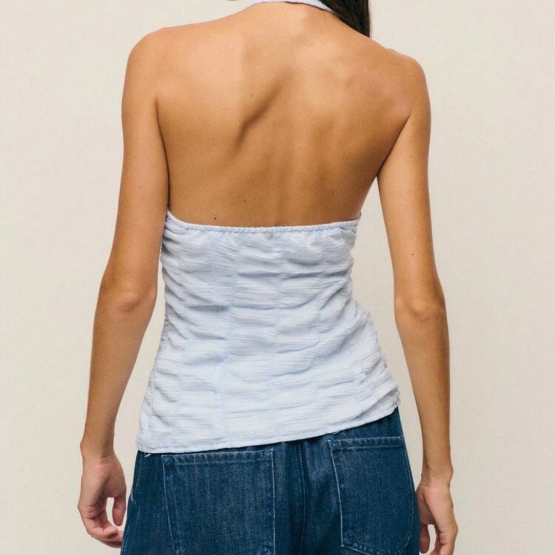 SHEIN Halter Top Light Blue with Ribbons S (Category: Sleeveless) located in Legazpi City. Submitted by loveagainz (Listing ID 1432846134, Image 2). Description: - Used once for my bora trip - Light blue halter top - Tie detail at neckline - Textured fabric - Sleeveless design - Fitted silhouette - Open back - Ideal for casual outings or beach trips.
