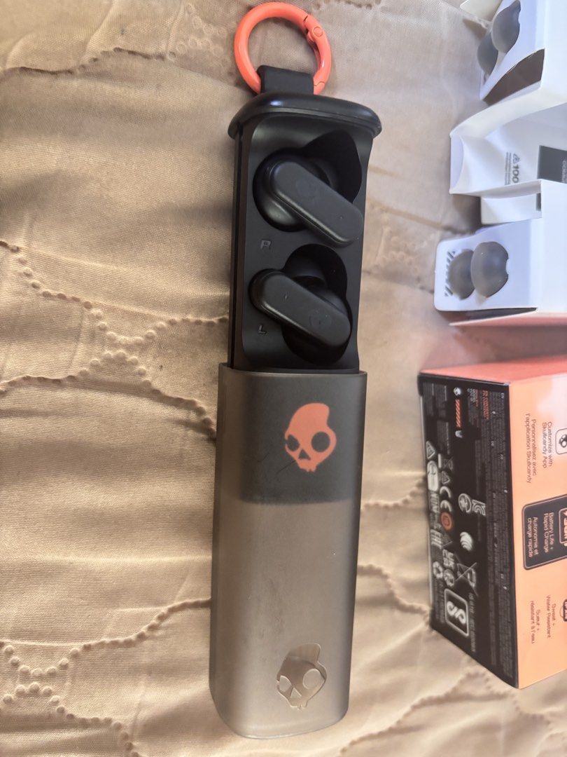 Skullcandy Dime Evo True Wireless Earbuds (Category: Earphones) located in Manila. Submitted by dyonii (Listing ID 1432839687, Image 2). Description: Skullcandy Dime Evo true wireless earbuds - Color: Black with orange skull logo - Used once only - Price is around ₱2.7k, selling for ₱2,000 only.