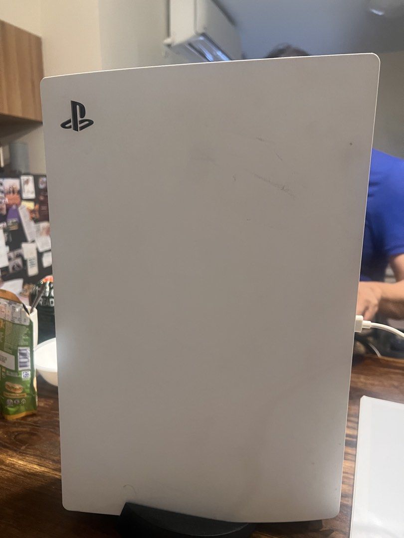 Sony PlayStation 5 Console (Category: PlayStation) located in Taguig. Submitted by carolextra (Listing ID 1432793555, Image 1). Description: - PlayStation 5 console - White with black stand - Features the PlayStation logo - Sleek design - Well-maintained.