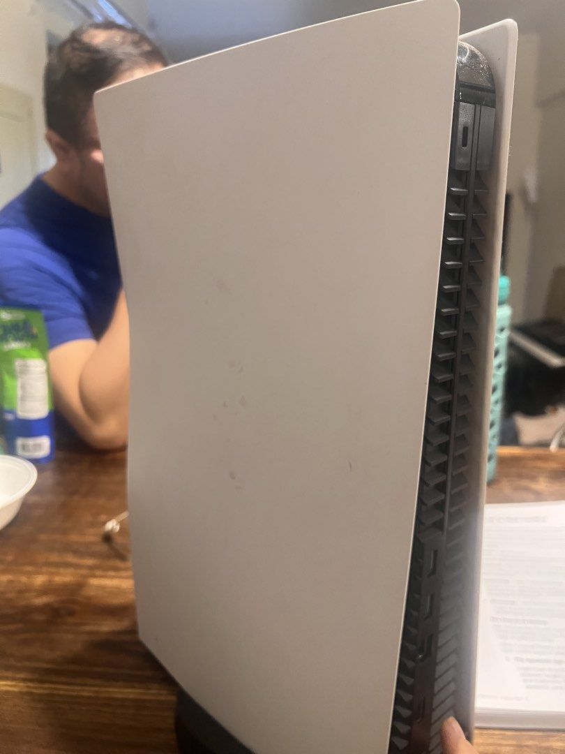 Sony PlayStation 5 Console (Category: PlayStation) located in Taguig. Submitted by carolextra (Listing ID 1432793555, Image 2). Description: - PlayStation 5 console - White with black stand - Features the PlayStation logo - Sleek design - Well-maintained.