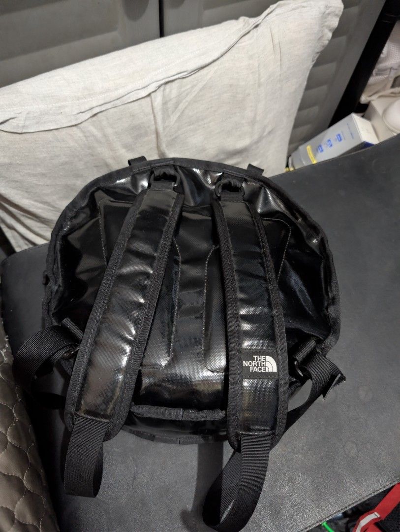 The North Face Backpack (Category: Backpacks) located in Imus. Submitted by kmoort (Listing ID 1432846931, Image 2). Description: - The North Face black backpack - Top handle and adjustable shoulder straps - Front zipper pocket - Small logo on the back - Made of durable, water-resistant material - Care label visible.
