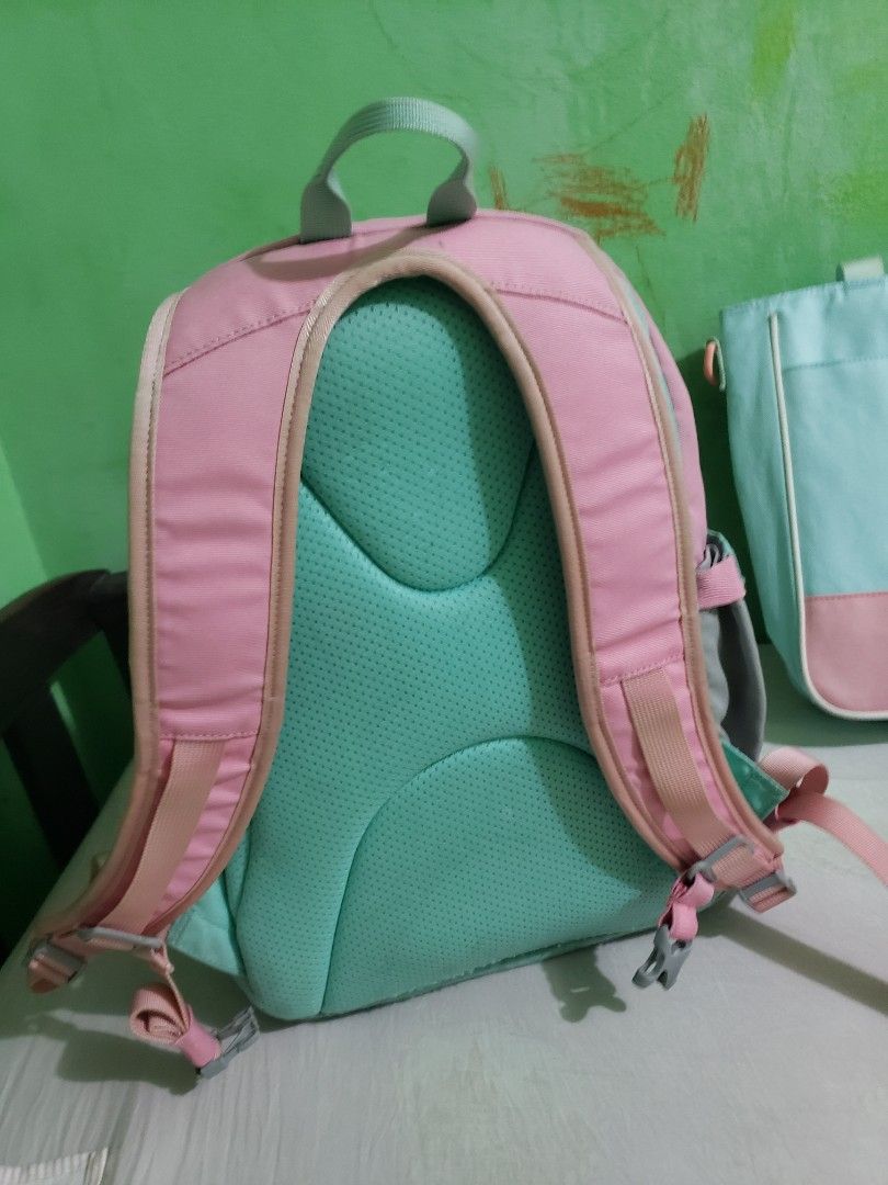 The North Face Backpack and Pouch Set (Category: Backpacks) located in Manila. Submitted by feg39 (Listing ID 1432877405, Image 3). Description: - The North Face backpack and nepa book bag set. - Color: Pink and teal. - Backpack features: - Front zipper pocket - Padded shoulder straps - Interior name tag - Pouch features: - Top handle - Zipper closure best for grade1-2 location pick up MARULAS VALENZUELA .