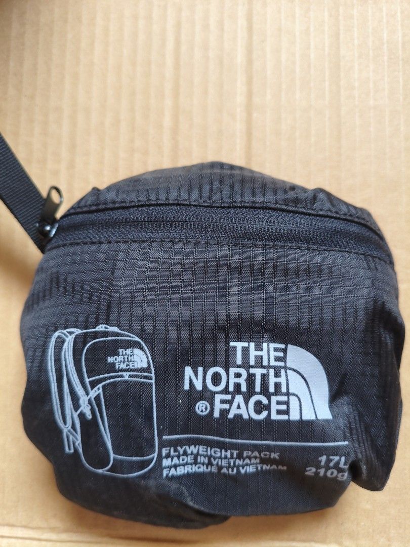 The North Face Flyweight Pack 17L (Category: Backpacks) located in Pasig City. Submitted by coolphoenix-29ac (Listing ID 1432866960, Image 1). Description: - The North Face Flyweight Pack - Made in Vietnam - 17L capacity - Lightweight at 210g - Classic black color - Secure zipper closure - Features the prominent North Face logo The North Face Flyweight Pack is an indispensable, extremely light weight 17 L companion to any travel bag line up. Made
