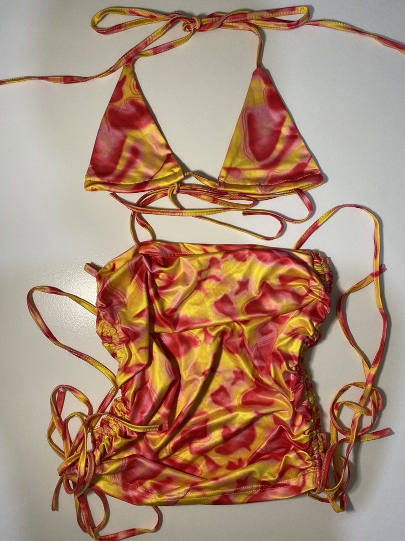 Tie-dye Bikini Set (Category: Bikinis & Swimsuits) located in Manila. Submitted by dodoheeee (Listing ID 1432912260, Image 1). Description: - Tie-dye bikini set - Colors: Yellow and red - Halter top - Adjustable tie bottoms - Silky, smooth fabric - Great for beach or pool parties.