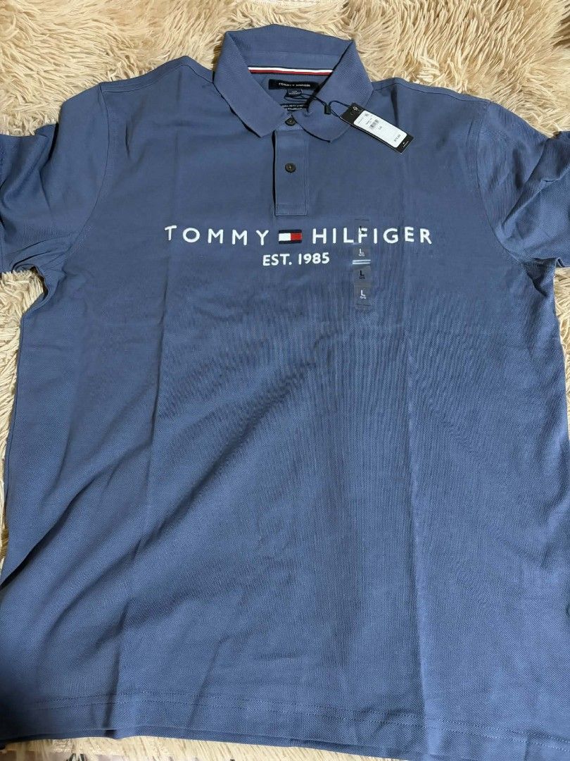 Tommy Hilfiger Polo Shirt - Blue (Category: Tshirts & Polo Shirts ) located in Pateros City. Submitted by armcandystuff (Listing ID 1432864468, Image 1). Description: - Authentic Tommy Hilfiger polo shirt - Stylish blue color - Features the iconic Tommy Hilfiger logo - Classic polo collar and short sleeves - Brand new with tag - Ideal for casual wear - Offers comfort and sophistication.