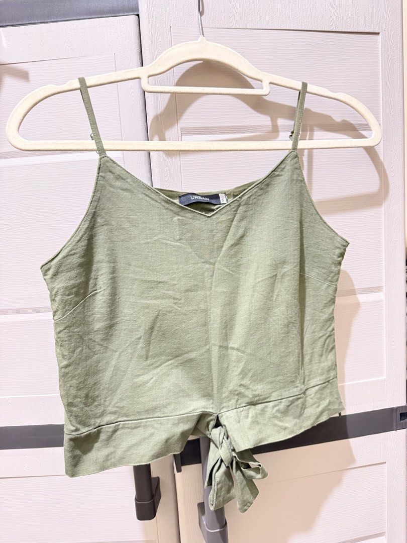 Urban Green Cami Top - Size S (Category: Sleeveless) located in San Juan City. Submitted by decluttering_0909 (Listing ID 1432999822, Image 1). Description: - Urban green cami top - Size small - Adjustable straps for a perfect fit - Tie detail at the back - Never worn, nakatambak lang .