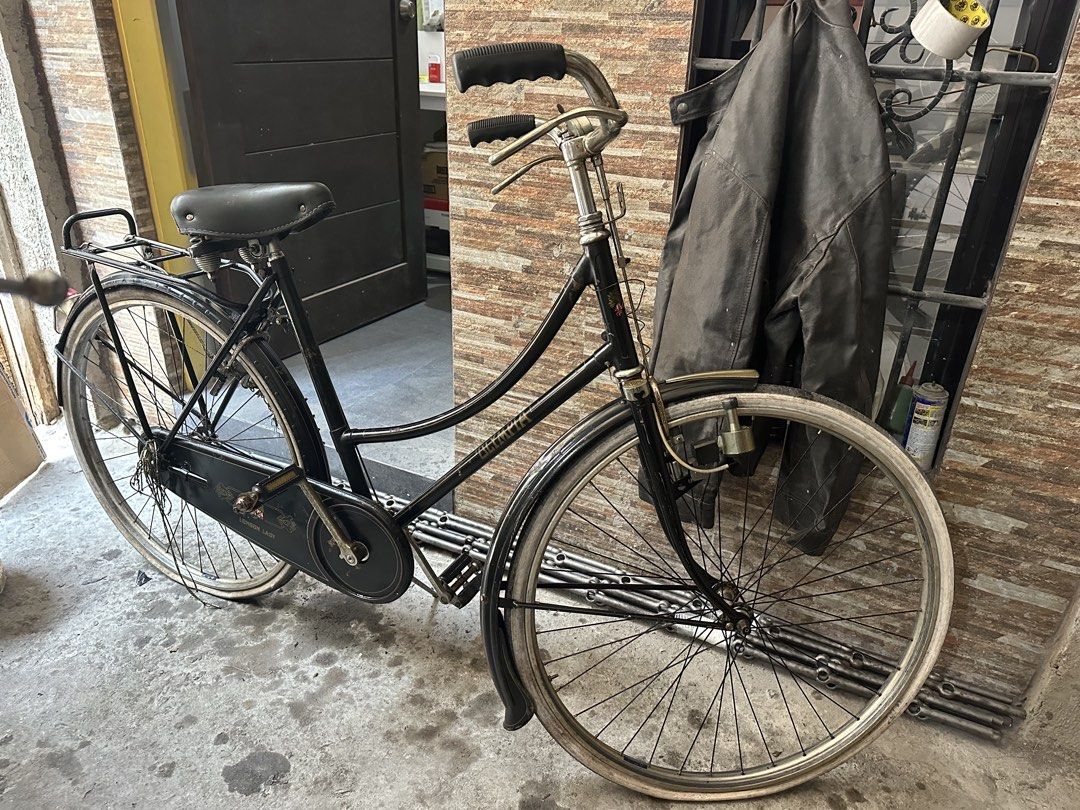 Vintage Bicycle (Category: Bicycles) located in Pateros City. Submitted by yamclassic83420 (Listing ID 1432804330, Image 1). Description: OLYMPIA ROADSTERS BIKE - Classic vintage bicycle - Black frame - Features rear rack and fenders - Includes chain guard - White sidewall tires - Comfortable seat and handlebars - Older model (mid-20th century).