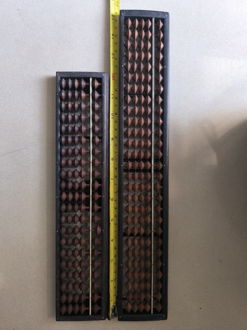 Vintage Wooden Abacus (Category: Vintage Collectibles) located in Manila. Submitted by lianlim.mail (Listing ID 1432799068, Image 1). Description: - Two vintage wooden abacuses from Japan - Sold as set - Features wooden beads and dark wood frames - Beads are intact take all for P550.