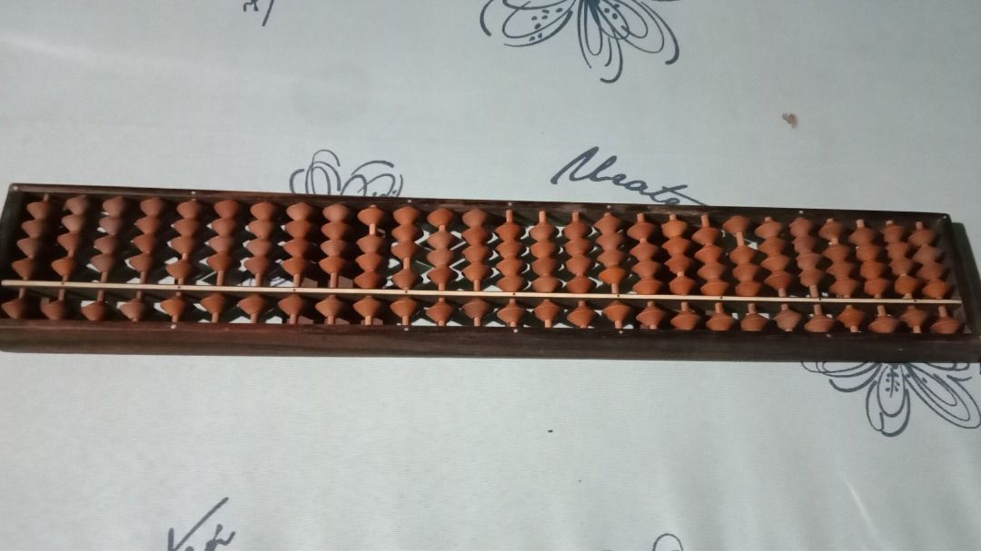 Vintage Wooden Soroban Abacus (27-Column) (Category: Vintage Collectibles) located in Manila. Submitted by balaiheritage.ph (Listing ID 1432814421, Image 3). Description: Selling this beautiful vintage Japanese-style soroban abacus (27 columns) 15 inches long and 7 cm. Solid wood frame and beads. Great for math practice or as an aesthetic display piece. Price: ₱1,800.00 (Negotiable) PM us if interested!.
