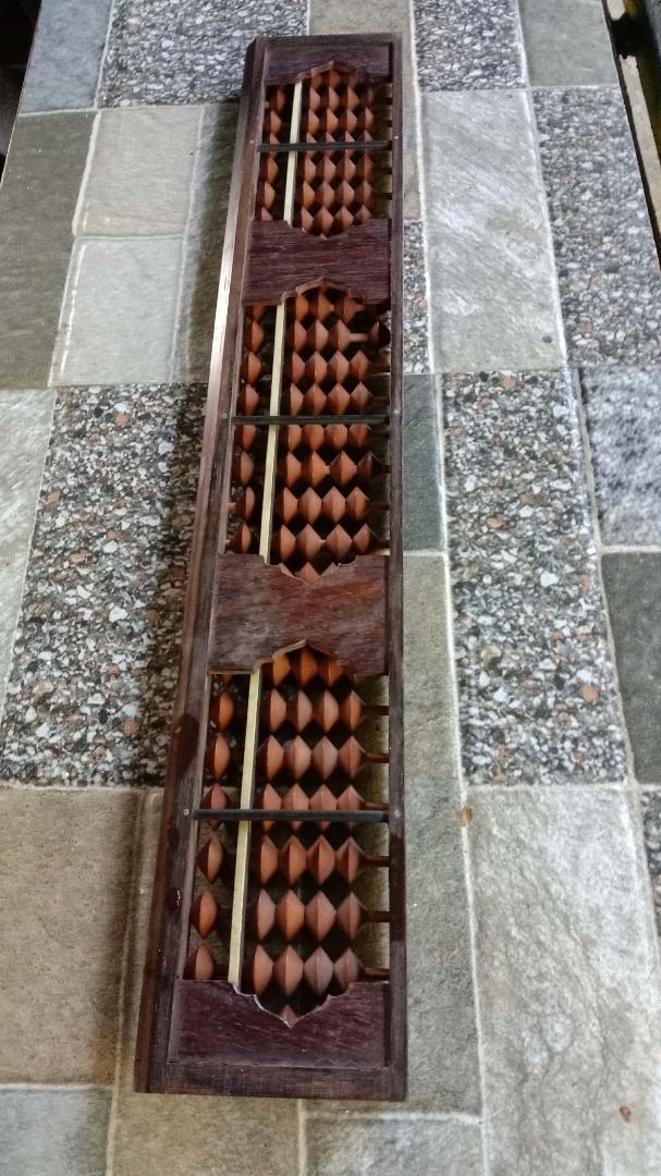 Vintage Wooden Soroban Abacus (27-Column) (Category: Vintage Collectibles) located in Manila. Submitted by balaiheritage.ph (Listing ID 1432814421, Image 2). Description: Selling this beautiful vintage Japanese-style soroban abacus (27 columns) 15 inches long and 7 cm. Solid wood frame and beads. Great for math practice or as an aesthetic display piece. Price: ₱1,800.00 (Negotiable) PM us if interested!.