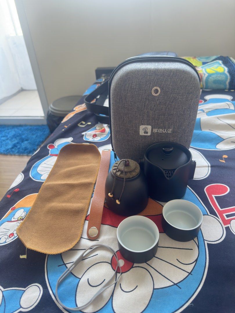 Wenshuo Travel Ceramic Tea Set (Category: Coffee & Tea Tableware) located in Taguig. Submitted by seek_and_ship (Listing ID 1432883681, Image 1). Description: - Travel Tea Set - Includes: Teapot, 2 Teacups, Tea Caddy, Carrying Case, Tea Cloth - Features: Sandalwood Handle, Portable Design - Color: Black - Perfect for tea on the go!.