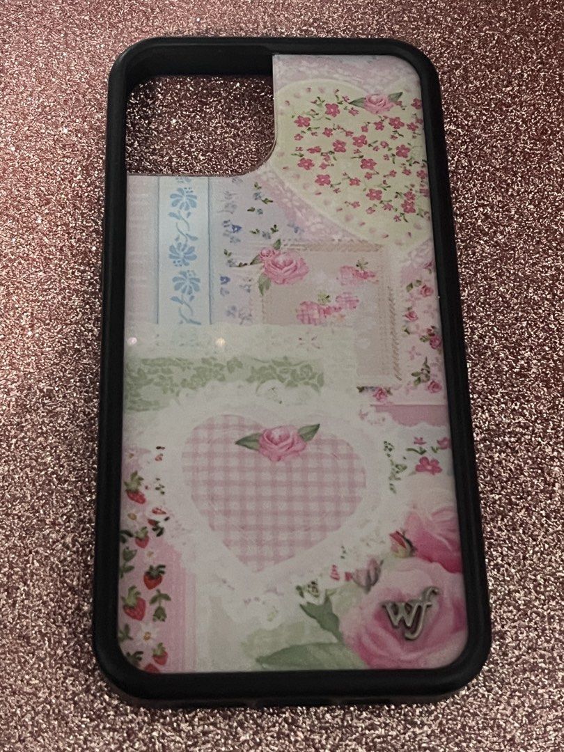 Wildflower case frilly floral (13/14) (Category: Cases & Sleeves) located in Manila. Submitted by alxdeclutters (Listing ID 1432825845, Image 2). Description: coquette barely used minor hair like scratches can send condi pics upon request💕 no stickers included.