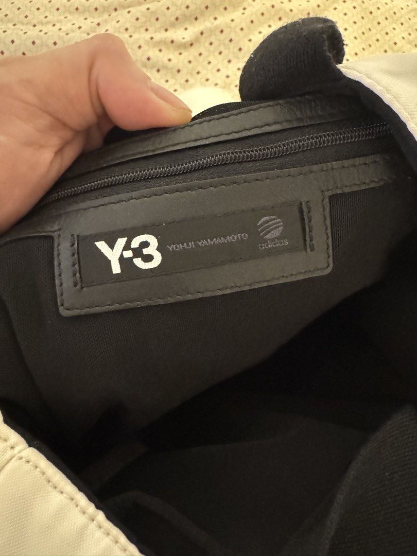 Y-3 Yohji Yamamoto Adidas Tote Bag (Category: Belt bags, Clutches and Pouches) located in Makati City. Submitted by marckyboy (Listing ID 1432973285, Image 3). Description: - Y-3 tote bag - Unique checkered design on the front - Zipper closure - Black handles - Spacious interior - Interior zippered pocket - Interior snap closure pocket - White with black accents - Y-3 and Adidas logos inside.