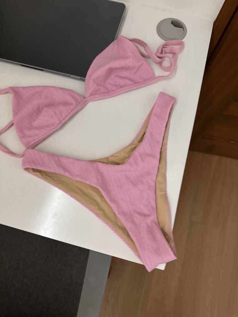 Zulu Zephyr Pink Bikini (Category: Bikinis & Swimsuits) located in Manila. Submitted by prebyb__ (Listing ID 1432813473, Image 2). Description: Zulu Zephyr Medium Pink Crinkle fabric - Pink bikini set - Includes triangle top and high-cut bottom - Features a textured, ribbed fabric - Soft pink color - Bottom lining in a lighter shade - Unworn condition.