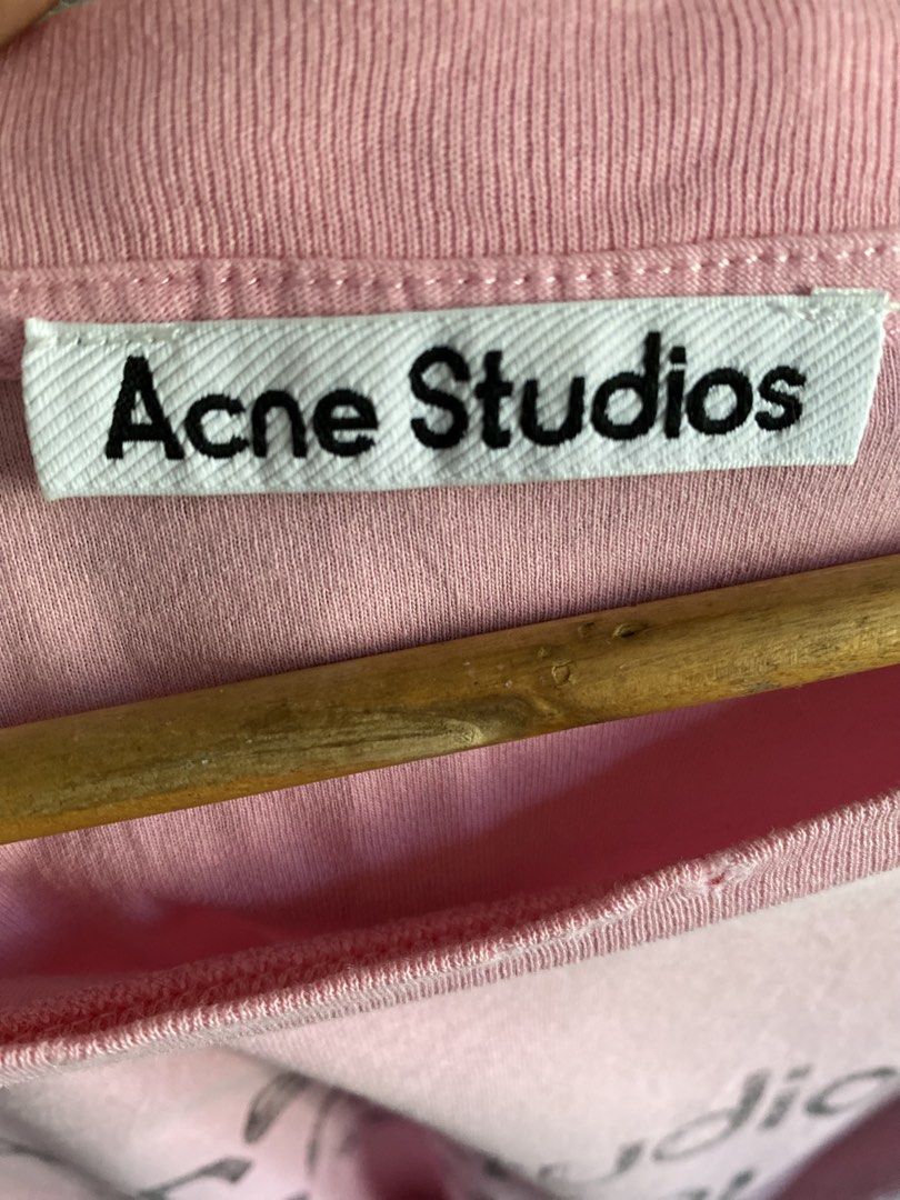 Acne Studios Stockholm 1996 Distress Pink T-shirt (Category: Luxury Apparel) located in Binmaley. Submitted by maryjeyn (Listing ID 1433033321, Image 3). Description: - Acne Studios T-shirt - Color: Pink - Print: "Acne Studios Stockholm 1996" - Size: XS - Made in Portugal - Material: 100% Cotton - Features: Crew neck, short sleeves and distress Tee.