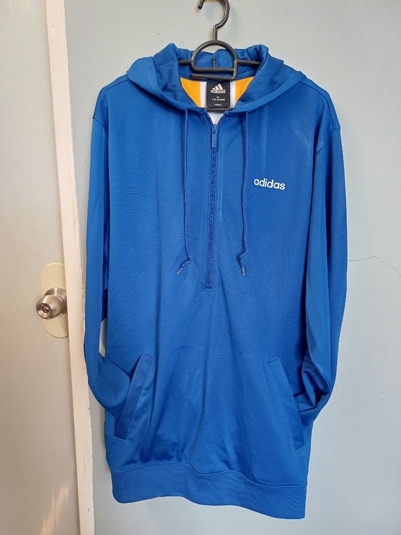 Adidas Blue Hoodie XL (Category: Hoodies) located in Calasiao. Submitted by mamadang (Listing ID 1433048554, Image 2). Description: - Adidas blue zip-up hoodie - Size: XL - Hood with yellow and white accents - Adidas logo on chest - Made in China - Interior lining: White and yellow - Manufacturing date: 03/05.