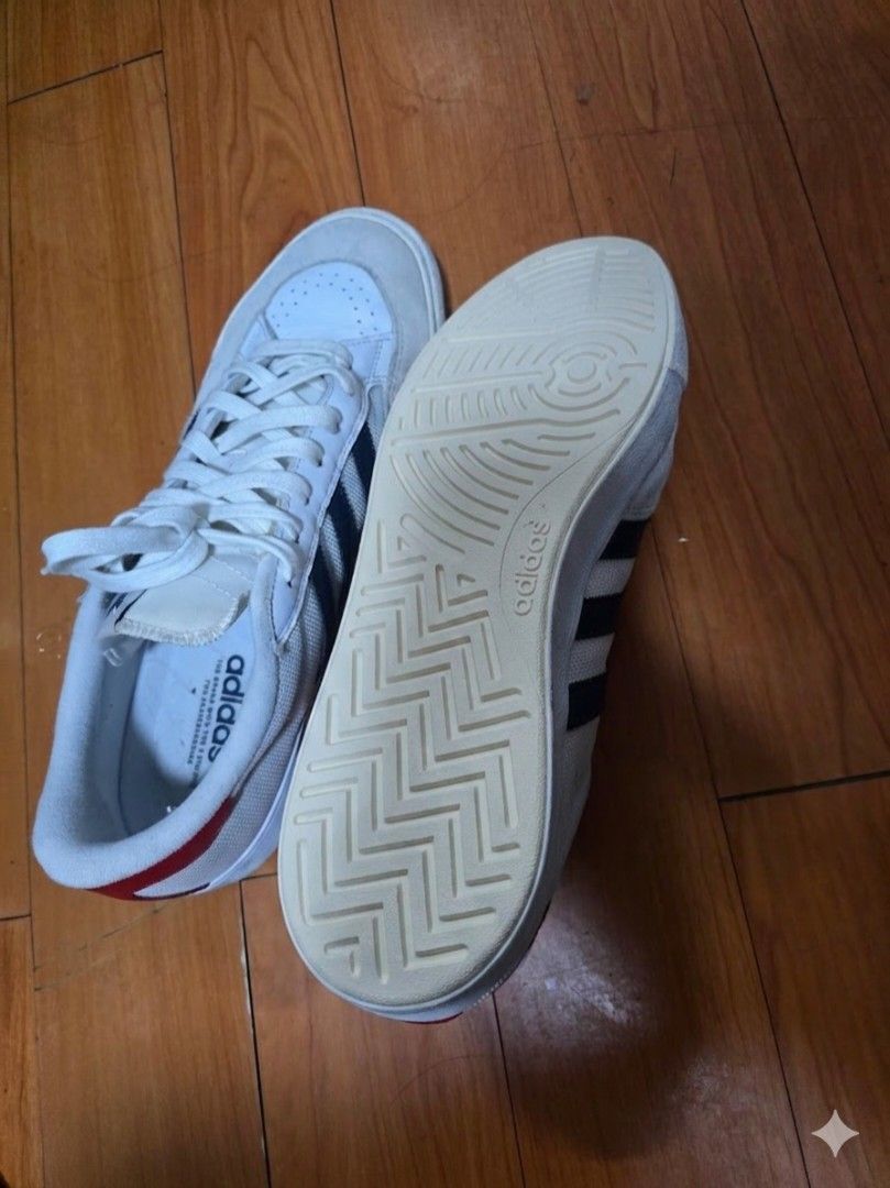 Adidas Nora Sneakers - White/Black/Red (Category: Sneakers) located in Muntinlupa City. Submitted by kc_10 (Listing ID 1433130631, Image 2). Description: - Adidas Nora - White with black stripes and red accents - Size: US 12, UK 11.5, EUR 46 - Made in Vietnam - Visible Adidas logo - Well-maintained.