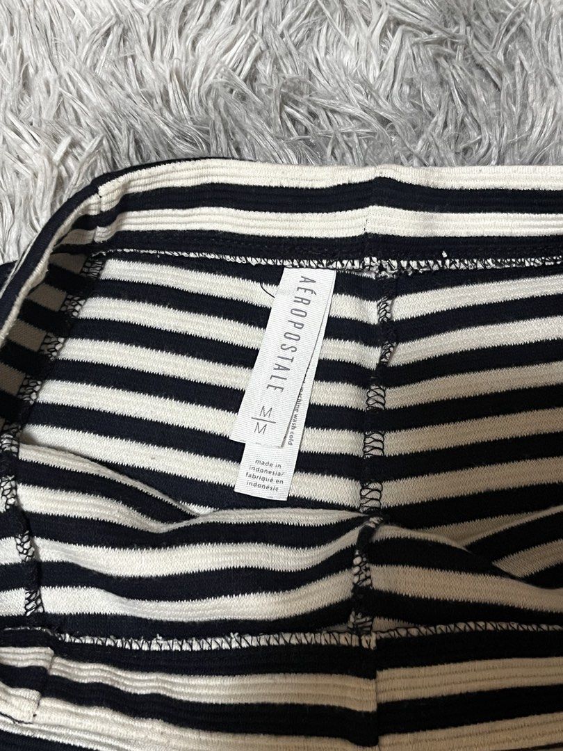Aeropostale Striped Skirt - Size M (Category: Skirts) located in Roxas. Submitted by lacerna_wears (Listing ID 1433025849, Image 2). Description: - Aeropostale skirt - Size: M - Color: Black and white stripes - Design: Flared silhouette - Made in Indonesia - Fabric: Textured feel - Versatile for various outfits.