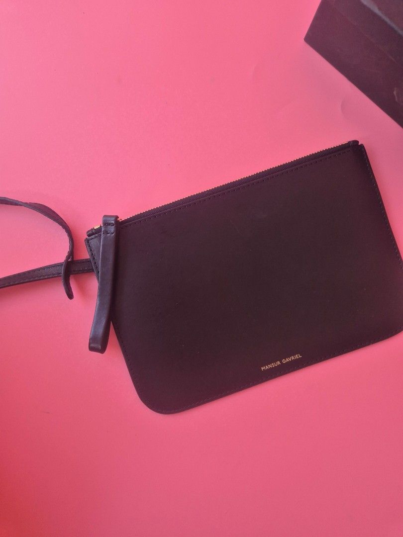 Mansur Gavriel Wrislet/Pouch 💯 Authentic (Category: Luxury Bags & Wallets) located in Manila. Submitted by _prettyquick (Listing ID 1433167133, Image 1). Description: SALE!!! FITS IPHONE PROMAX preowned pls manage your expectations 100% authentic Follow us on instagram for more items @_prettyquick or Prettyquick luxury for FBPAGE with 12kfollowers.