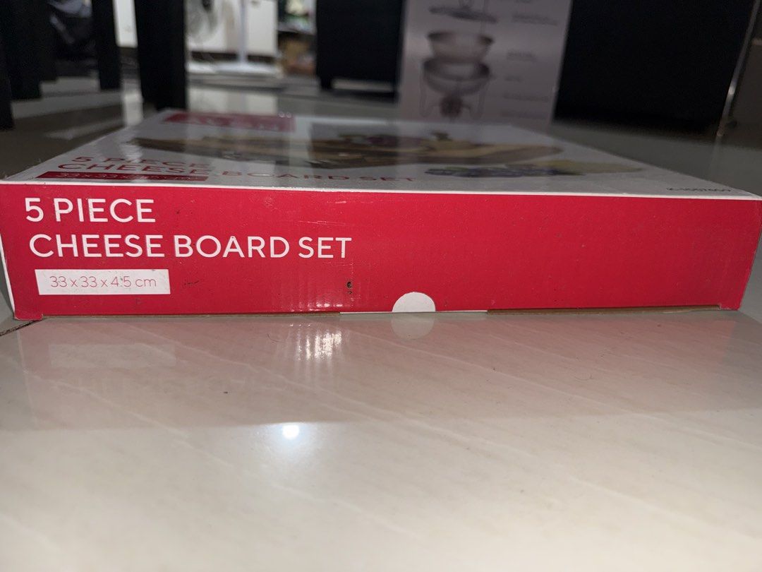 Avon 5 Piece Cheese Board Set (Category: Other Kitchenware & Tableware) located in Marilao. Submitted by ryuryuzj73716 (Listing ID 1433063148, Image 2). Description: - Avon 5-piece cheese board set - Includes wooden cheese board - Features a pull-out drawer - Comes with cheese knives - Box dimensions: 33 x 33 x 4.5 cm - Ideal for serving cheese and snacks.