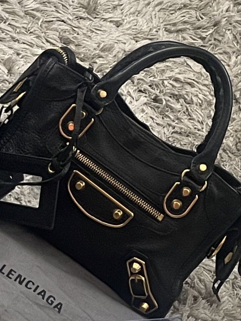 balenciaga mini edge (Category: Luxury Bags & Wallets) located in Mandaluyong City. Submitted by jen2_declutters (Listing ID 1433074330, Image 1). Description: BALENCIAGA MINI EDGE black with gold hardware very good condition with signs of usage comes with dustbag, mirror, strap, entrupty certificate bpi/ metrobank/ g cash open for meet up 69,000 ( negotiable).