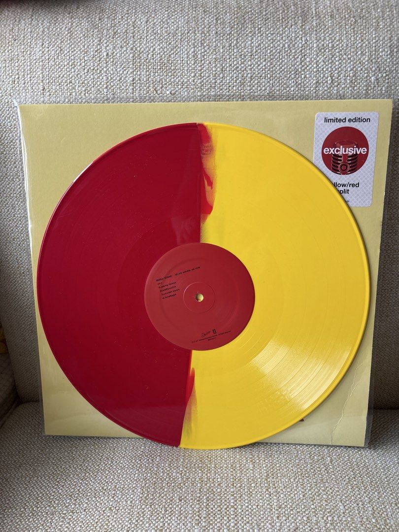 Billie Eilish - Happier Than Ever (Yellow/Red Split) (Category: Vinyls) located in Taguig. Submitted by anik.ph (Listing ID 1433033583, Image 3). Description: - Limited edition "Happier Than Ever" vinyl record by Billie Eilish. - Features a striking yellow and red split design. - Includes original packaging. - Tracklist visible on the back, featuring songs like "Copycat", "My Boy", and "Hostage"..