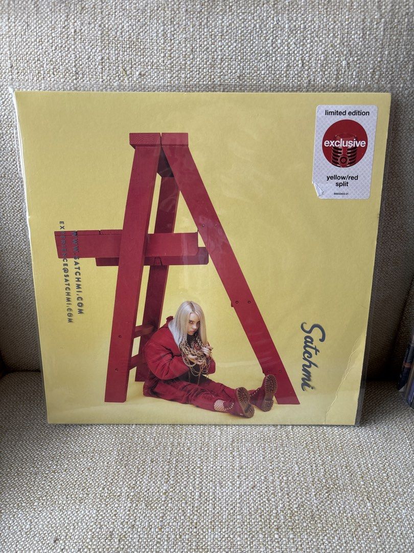 Billie Eilish - Happier Than Ever (Yellow/Red Split) (Category: Vinyls) located in Taguig. Submitted by anik.ph (Listing ID 1433033583, Image 1). Description: - Limited edition "Happier Than Ever" vinyl record by Billie Eilish. - Features a striking yellow and red split design. - Includes original packaging. - Tracklist visible on the back, featuring songs like "Copycat", "My Boy", and "Hostage"..