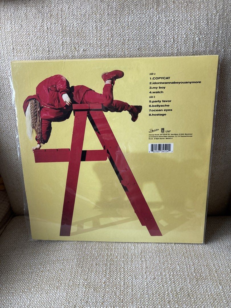 Billie Eilish - Happier Than Ever (Yellow/Red Split) (Category: Vinyls) located in Taguig. Submitted by anik.ph (Listing ID 1433033583, Image 2). Description: - Limited edition "Happier Than Ever" vinyl record by Billie Eilish. - Features a striking yellow and red split design. - Includes original packaging. - Tracklist visible on the back, featuring songs like "Copycat", "My Boy", and "Hostage"..