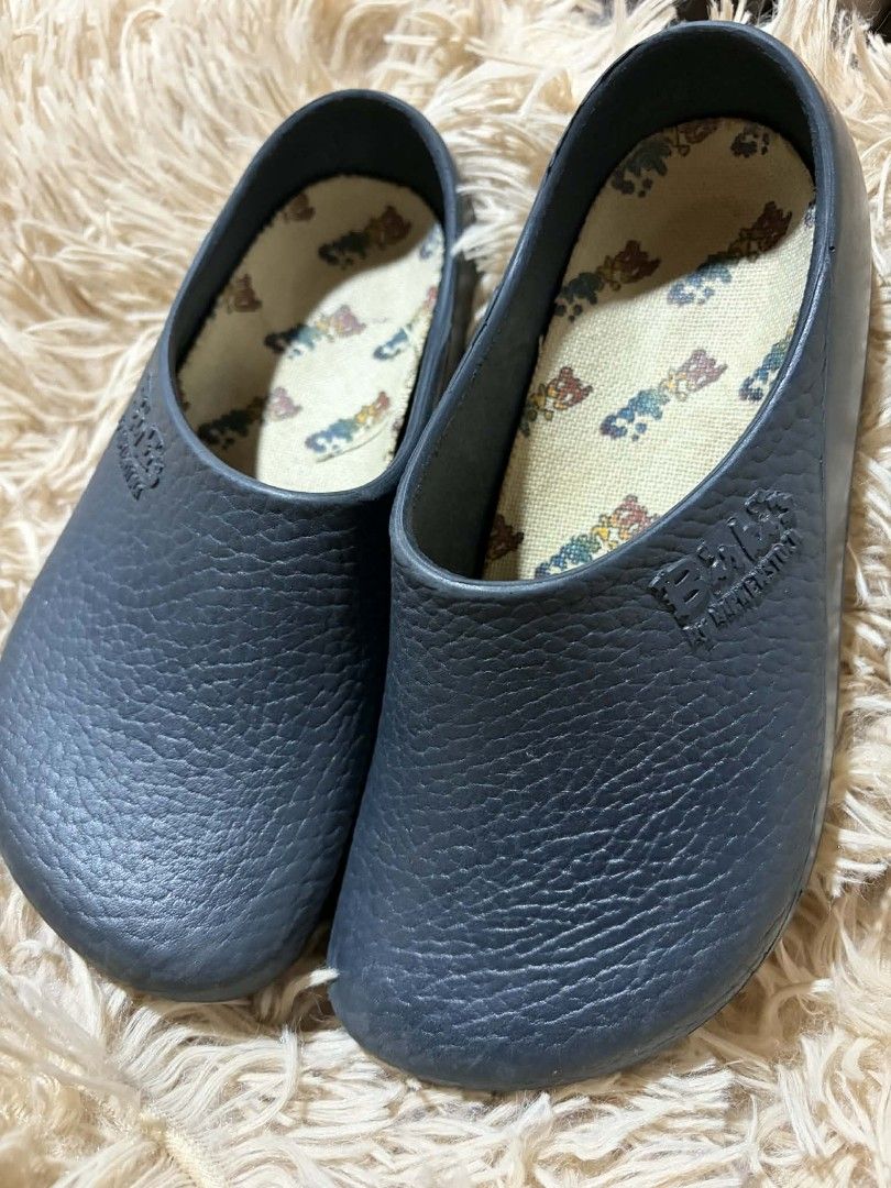 Birki's by Birkenstock Clogs 21cm (Category: Babies & Kids Fashion) located in Pateros City. Submitted by armcandystuff (Listing ID 1433085347, Image 1). Description: - Birki's by Birkenstock clogs - 21cm - Dark blue color - Textured exterior - Slip-on style - Patterned insole - Birki's logo visible.