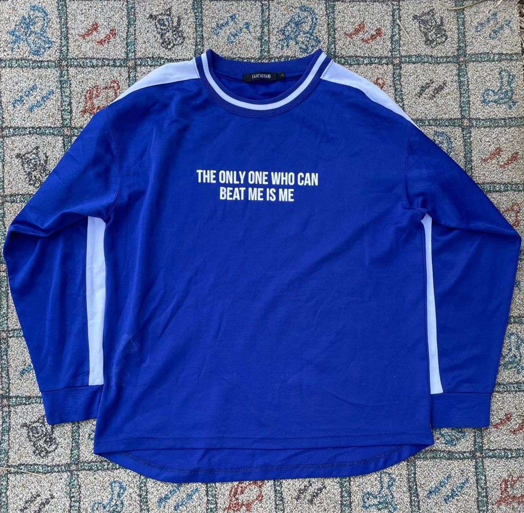 Blue Sweatshirt with Quote (Category: Activewear) located in Manila. Submitted by stepsole (Listing ID 1433206665, Image 1). Description: - Blue sweatshirt - White collar and sleeve stripes - Features the quote: "THE ONLY ONE WHO CAN BEAT ME IS ME" - Long sleeves - Round neck - Comfortable material.
