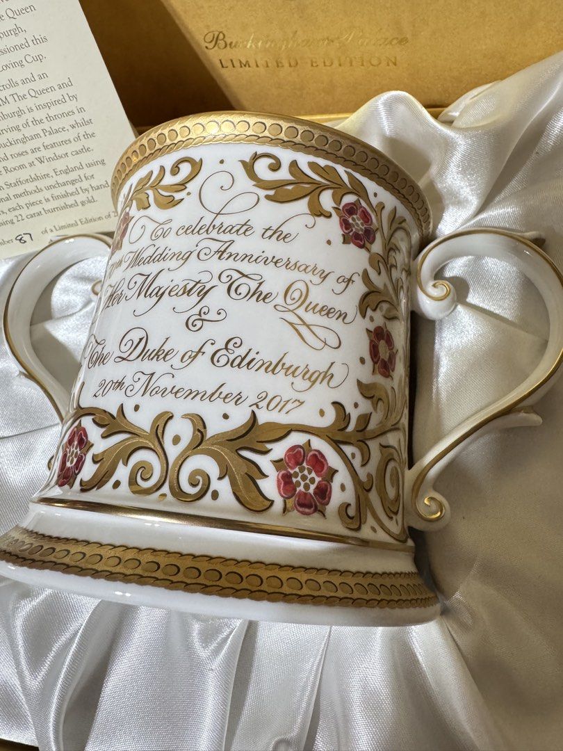 Buckingham Palace 70th Anniversary Loving Cup (Category: Coffee & Tea Tableware) located in Las Pinas. Submitted by emdjss (Listing ID 1433058331, Image 2). Description: - Limited Edition Buckingham Palace Loving Cup - Commemorates the 70th Wedding Anniversary of HM The Queen and HRH The Duke of Edinburgh - Features a design of golden scrolls - Hand-finished with 22-carat burnished gold - Number 87 of a limited edition of 250 - Made in Staffordsh