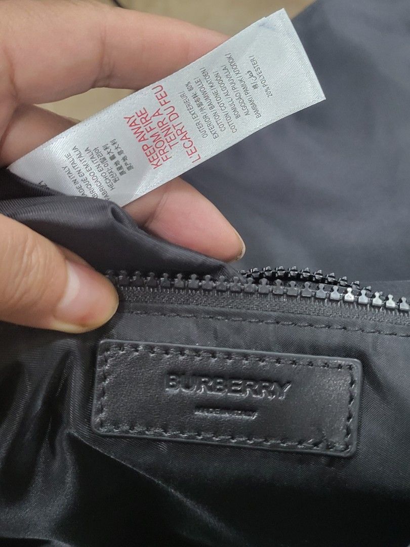 Burberry Crossbody Bag (Category: Luxury Bags & Wallets) located in Manila. Submitted by milkymitch23 (Listing ID 1433028252, Image 3). Description: - Burberry crossbody bag - Black color - Main compartment with zipper - Interior pocket - Front flap with buckle closure - Adjustable shoulder strap with Burberry logo buckle - Made in Italy - pm sa issue.