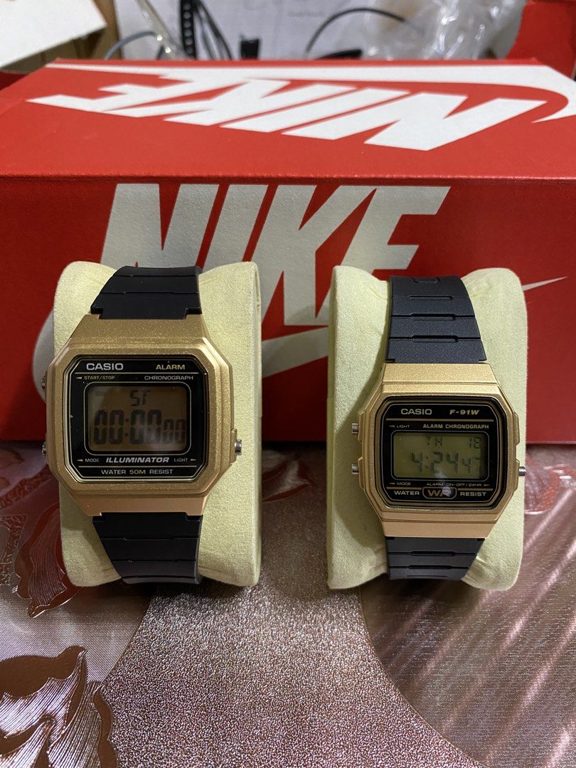 Casio Digital Watch Gold (Category: Women's Watches) located in Lingayen. Submitted by rizzaairtsua6 (Listing ID 1433044412, Image 1). Description: - Two Casio digital watches - Gold-colored cases, black straps - Watch 1: Casio F-91W model - Watch 1: Alarm and illuminator - Watch 2: Water-resistant - Both: Digital displays - Both: Casio branding on straps.